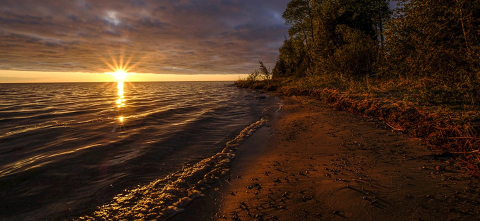 A sunset over a bay